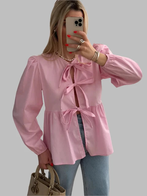 Women's blouse with puff sleeves and bow detail