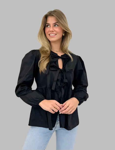 Women's blouse with puff sleeves and bow detail