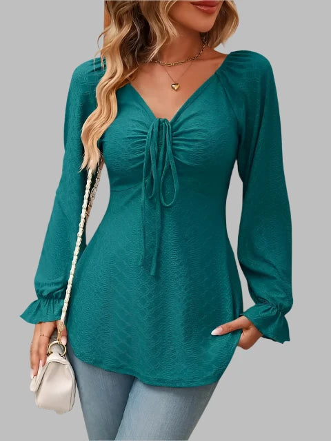 Women's blouse with heart shaped neck balloon sleeves and bow detail at front